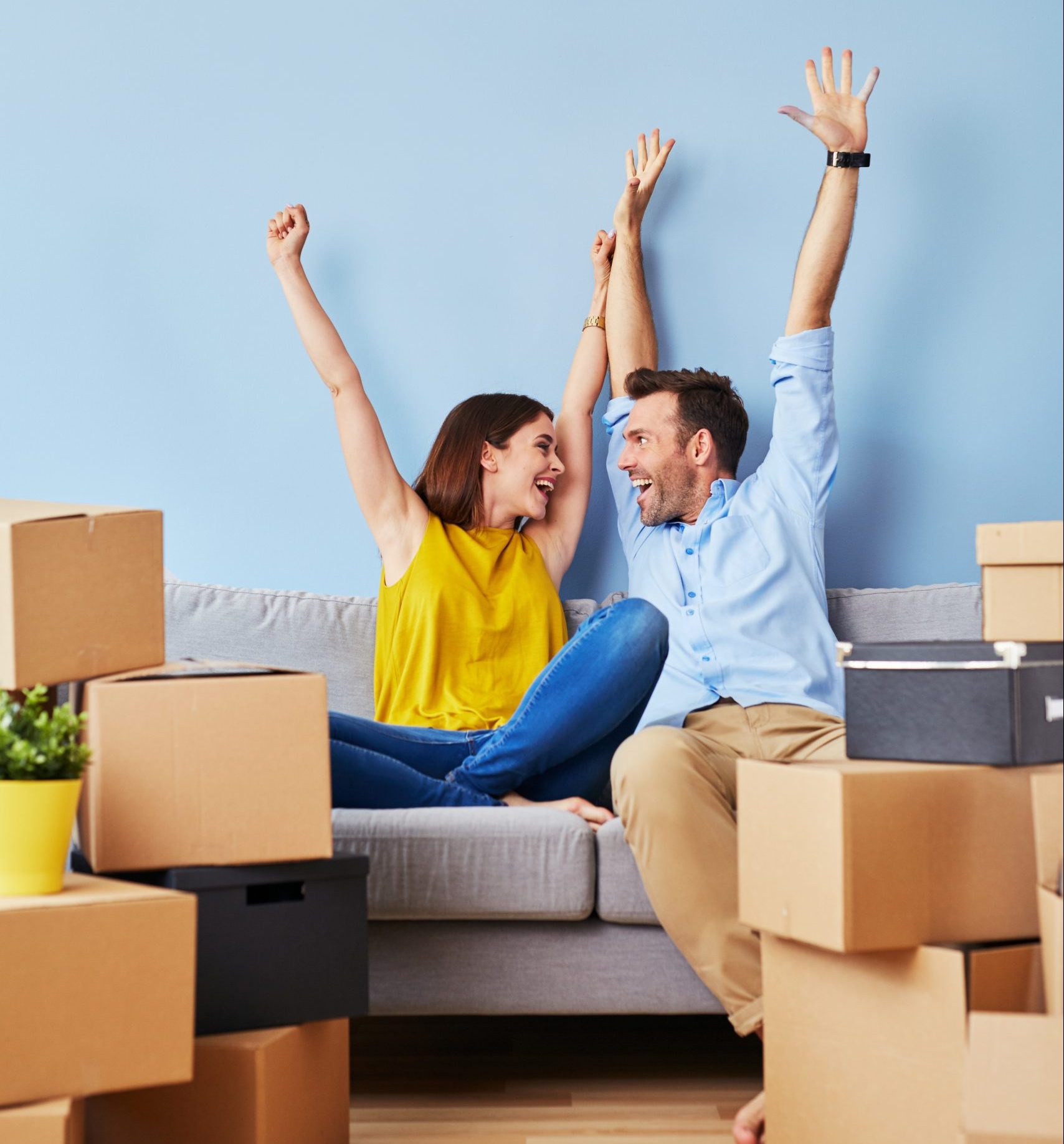 Excited couple moving to new apartment