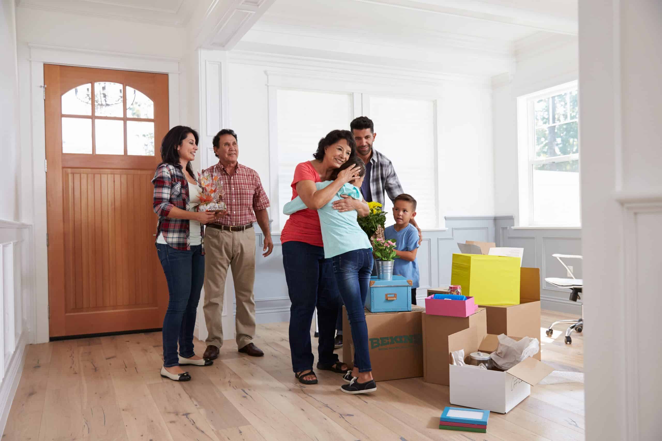 Grandparents Visiting Hispanic Family In New Home